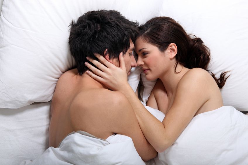 14104859 - affectionate couple kissing in bed
